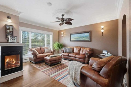 28 Oakdale Place, Red Deer, AB - Indoor Photo Showing Living Room With Fireplace