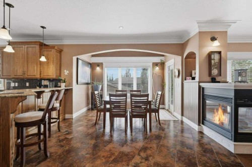 28 Oakdale Place, Red Deer, AB - Indoor Photo Showing Dining Room With Fireplace