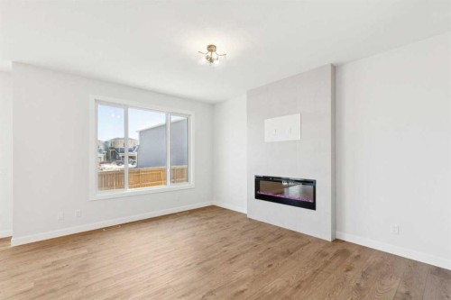 425 Lewiston Landing Ne, Calgary, AB - Indoor Photo Showing Living Room With Fireplace