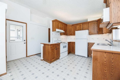 13 Duval Crescent, Red Deer, AB - Indoor Photo Showing Kitchen With Double Sink