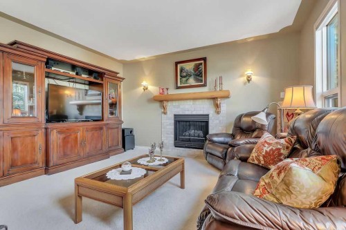 6406 55 Avenue, Ponoka, AB - Indoor Photo Showing Living Room With Fireplace