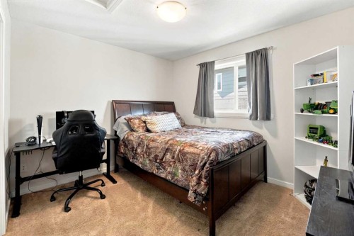 84 Mackenzie Crescent, Lacombe, AB - Indoor Photo Showing Bedroom