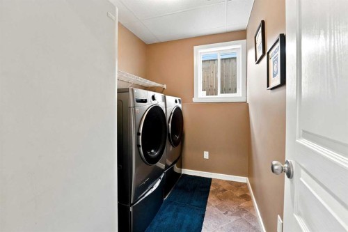 84 Mackenzie Crescent, Lacombe, AB - Indoor Photo Showing Laundry Room