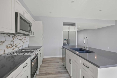 113 Aztec Crescent, Blackfalds, AB - Indoor Photo Showing Kitchen With Double Sink With Upgraded Kitchen