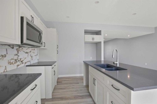 113 Aztec Crescent, Blackfalds, AB - Indoor Photo Showing Kitchen With Double Sink