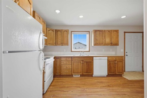 18 Terrace Heights Drive, Lacombe, AB - Indoor Photo Showing Kitchen With Double Sink