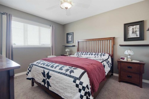 56 Heron Court, Penhold, AB - Indoor Photo Showing Bedroom