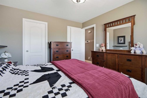 56 Heron Court, Penhold, AB - Indoor Photo Showing Bedroom