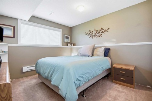 56 Heron Court, Penhold, AB - Indoor Photo Showing Bedroom