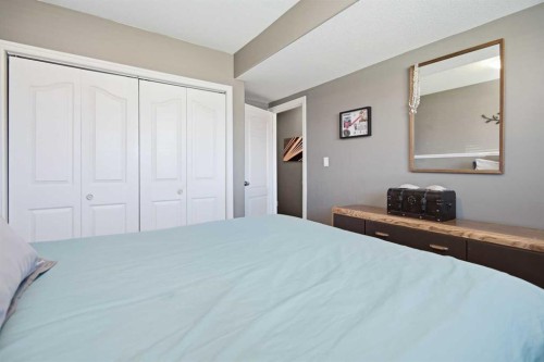 56 Heron Court, Penhold, AB - Indoor Photo Showing Bedroom