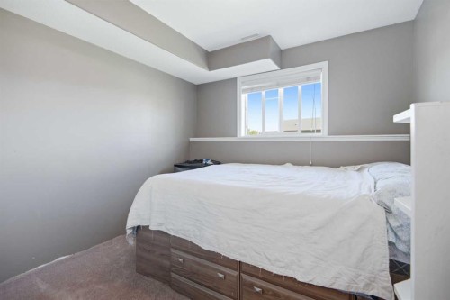 56 Heron Court, Penhold, AB - Indoor Photo Showing Bedroom
