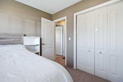 56 Heron Court, Penhold, AB - Indoor Photo Showing Bedroom