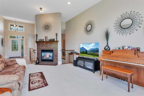 15 Liberty Place, Sylvan Lake, AB - Indoor Photo Showing Living Room With Fireplace