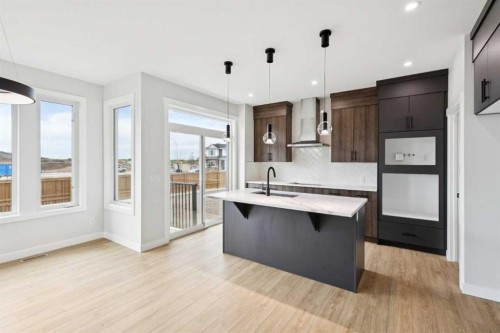 102 Bridgeport Landing, Chestermere, AB - Indoor Photo Showing Kitchen With Upgraded Kitchen