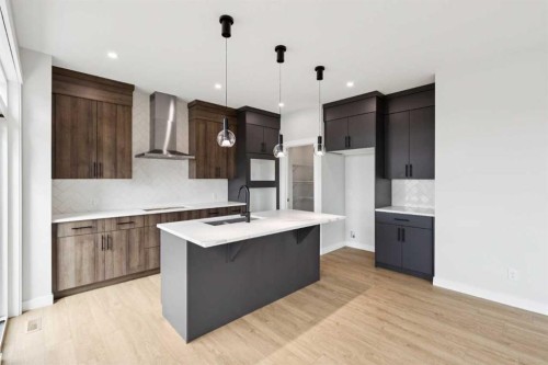 102 Bridgeport Landing, Chestermere, AB - Indoor Photo Showing Kitchen With Upgraded Kitchen