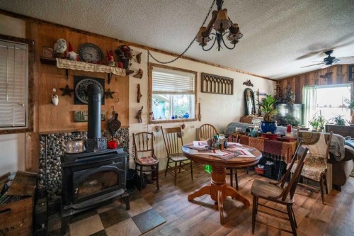 310 Beaver Street, Ferintosh, AB - Indoor Photo Showing Dining Room With Fireplace