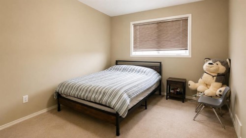 83 Lakeway Boulevard, Sylvan Lake, AB - Indoor Photo Showing Bedroom
