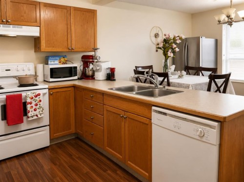 83 Lakeway Boulevard, Sylvan Lake, AB - Indoor Photo Showing Kitchen With Double Sink