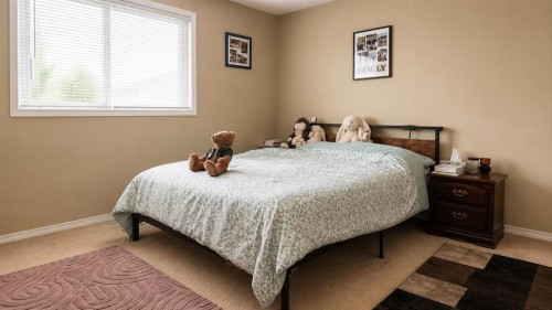 83 Lakeway Boulevard, Sylvan Lake, AB - Indoor Photo Showing Bedroom