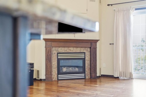 301-3505 51 Avenue, Red Deer, AB - Indoor Photo Showing Living Room With Fireplace