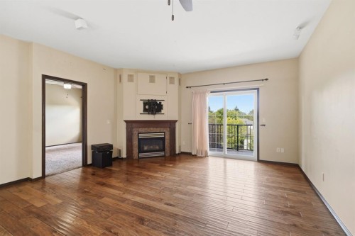301-3505 51 Avenue, Red Deer, AB - Indoor Photo Showing Living Room With Fireplace