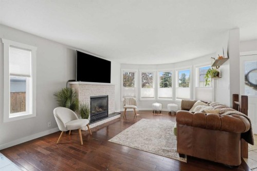 5 Westwood Crescent, Sylvan Lake, AB - Indoor Photo Showing Living Room With Fireplace