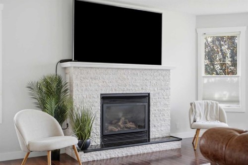 5 Westwood Crescent, Sylvan Lake, AB - Indoor Photo Showing Living Room With Fireplace
