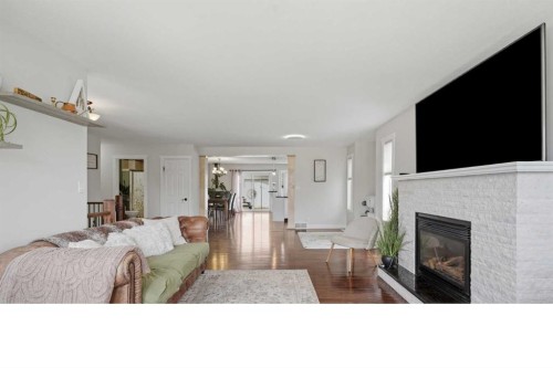 5 Westwood Crescent, Sylvan Lake, AB - Indoor Photo Showing Living Room With Fireplace
