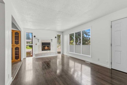 4719 46 Avenue, Sylvan Lake, AB - Indoor Photo Showing Other Room With Fireplace