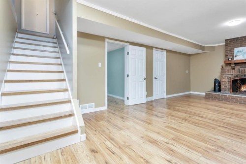 5215 52 Avenue, Eckville, AB - Indoor Photo Showing Other Room With Fireplace