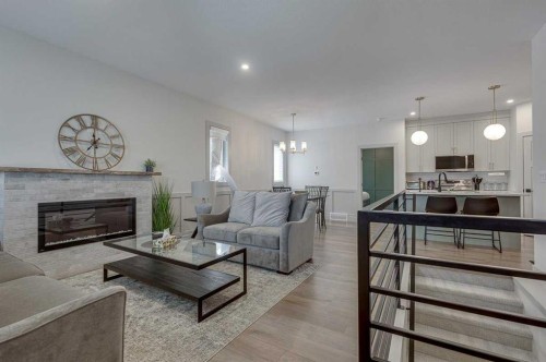 3-5324 49 Avenue, Lacombe, AB - Indoor Photo Showing Living Room With Fireplace