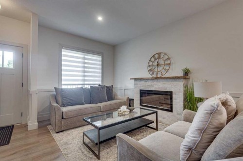 3-5324 49 Avenue, Lacombe, AB - Indoor Photo Showing Living Room With Fireplace