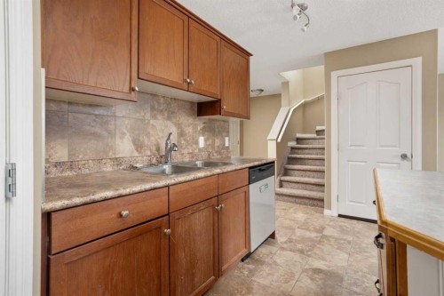 6-6802 50 Avenue, Camrose, AB - Indoor Photo Showing Kitchen With Double Sink