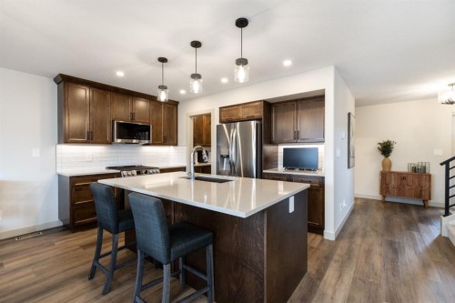 22 Napoleon Meadows Way, Innisfail, AB - Indoor Photo Showing Kitchen With Stainless Steel Kitchen With Upgraded Kitchen