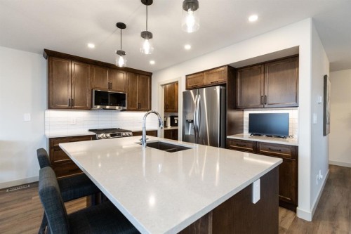 22 Napoleon Meadows Way, Innisfail, AB - Indoor Photo Showing Kitchen With Stainless Steel Kitchen With Double Sink With Upgraded Kitchen