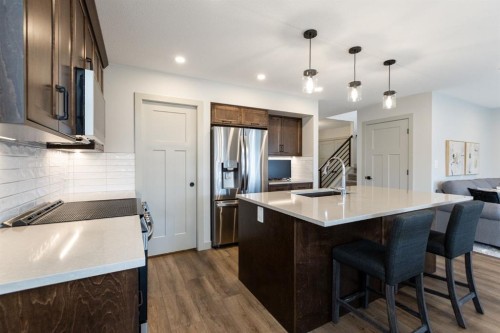 22 Napoleon Meadows Way, Innisfail, AB - Indoor Photo Showing Kitchen With Stainless Steel Kitchen With Upgraded Kitchen