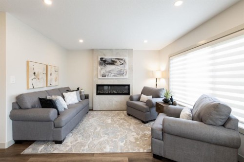 22 Napoleon Meadows Way, Innisfail, AB - Indoor Photo Showing Living Room With Fireplace