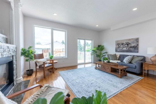 5140 51 Street, Lacombe, AB - Indoor Photo Showing Living Room With Fireplace