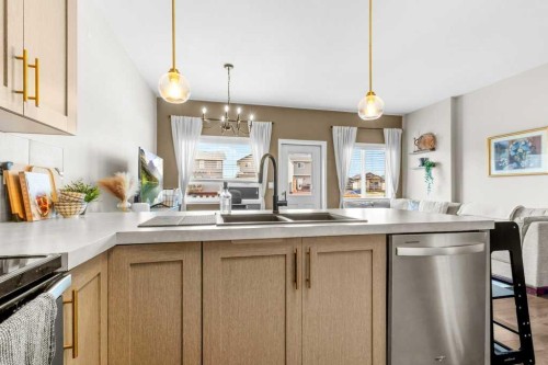 125 Henderson Crescent, Penhold, AB - Indoor Photo Showing Kitchen With Double Sink