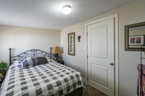 4 48A Street Close, Alix, AB - Indoor Photo Showing Bedroom