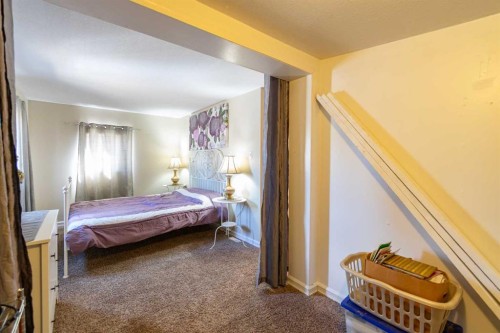 4 48A Street Close, Alix, AB - Indoor Photo Showing Bedroom
