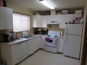 595-100 Jordan Parkway, Red Deer, AB  - Indoor Photo Showing Kitchen With Double Sink 