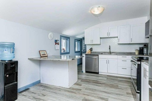 5003 48 Street, Innisfail, AB - Indoor Photo Showing Kitchen With Double Sink With Upgraded Kitchen
