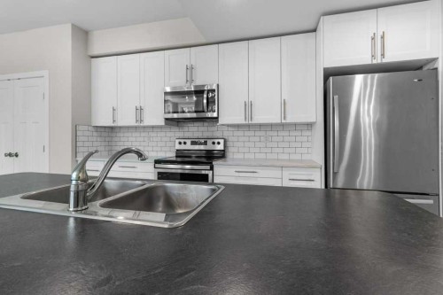 3902 46 Street, Red Deer, AB - Indoor Photo Showing Kitchen With Double Sink With Upgraded Kitchen