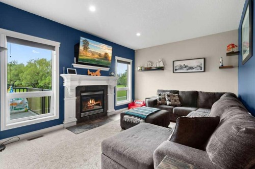 6002 Orr Drive, Red Deer, AB - Indoor Photo Showing Living Room With Fireplace