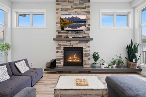 1 Meadow Close, Lacombe, AB - Indoor Photo Showing Living Room With Fireplace