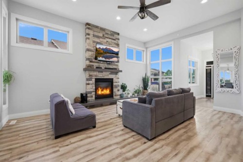 1 Meadow Close, Lacombe, AB - Indoor Photo Showing Living Room With Fireplace