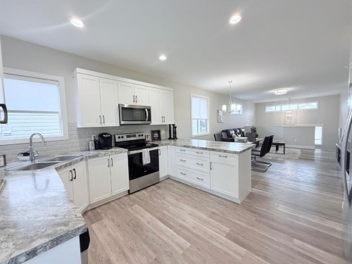 58 Village Crescent, Red Deer, AB - Indoor Photo Showing Kitchen With Double Sink