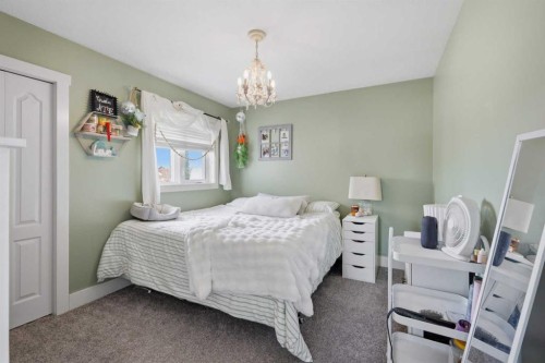 13 Hendrickson Bay, Sylvan Lake, AB - Indoor Photo Showing Bedroom
