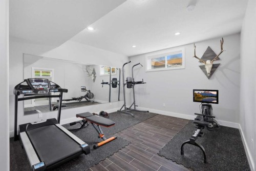 13 Hendrickson Bay, Sylvan Lake, AB - Indoor Photo Showing Gym Room